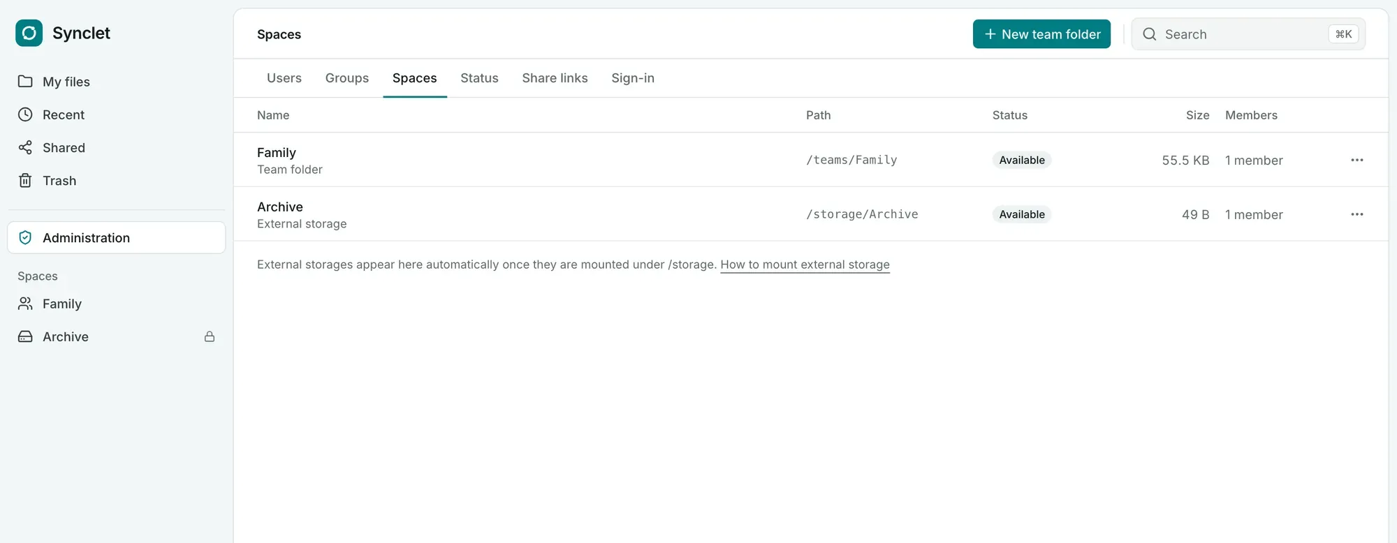 The admin page Spaces listing the team folder Family and the external storage Archive with their members and status.